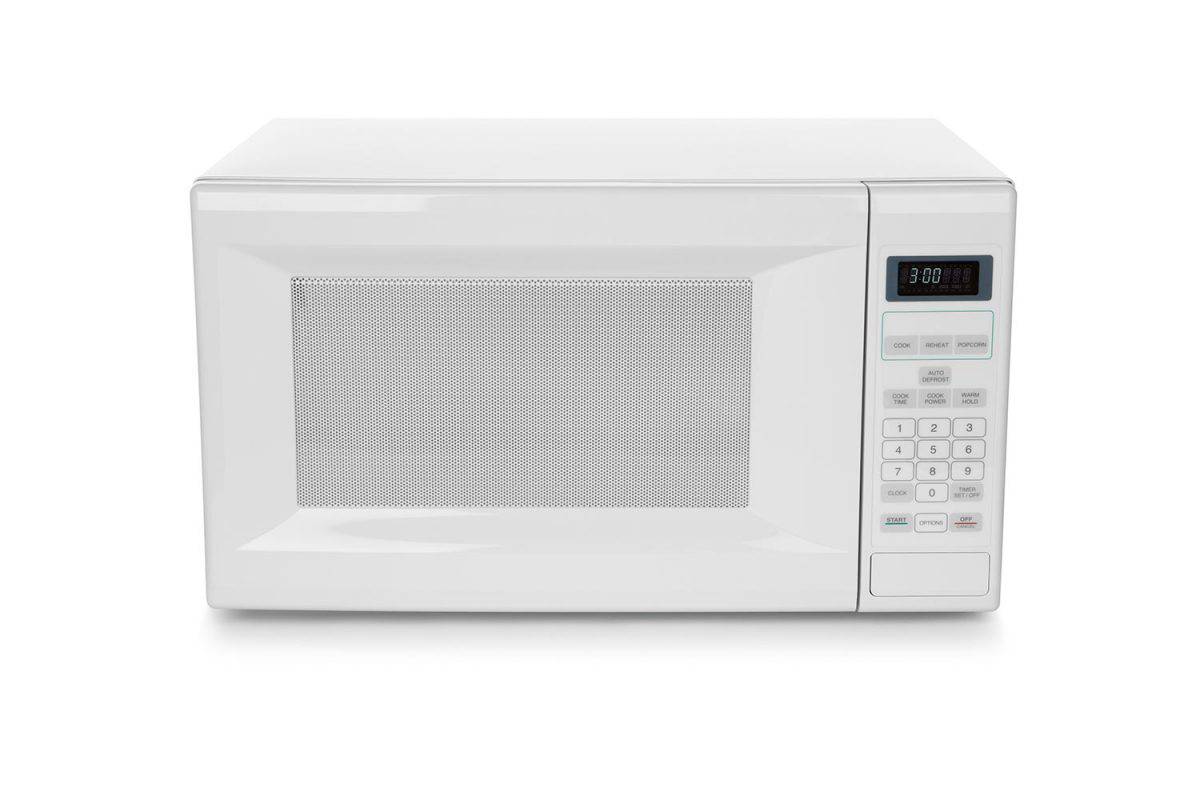 White microwave oven on white background