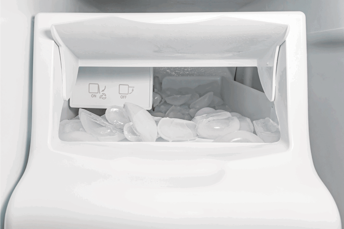 ice maker, machine, in refrigerator with ice cubes