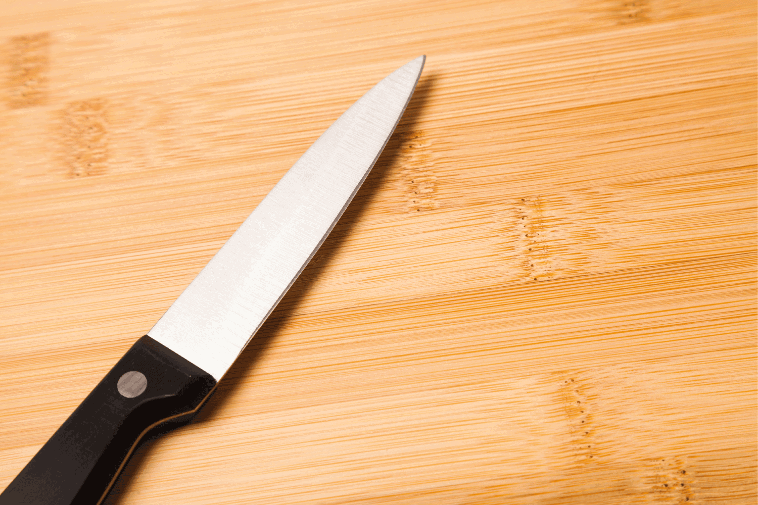 metal knife on cutting board