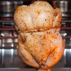 A delicious chicken being cooked inside a rotisserie, Does The Cuisinart Air Fryer Have A Rotisserie?