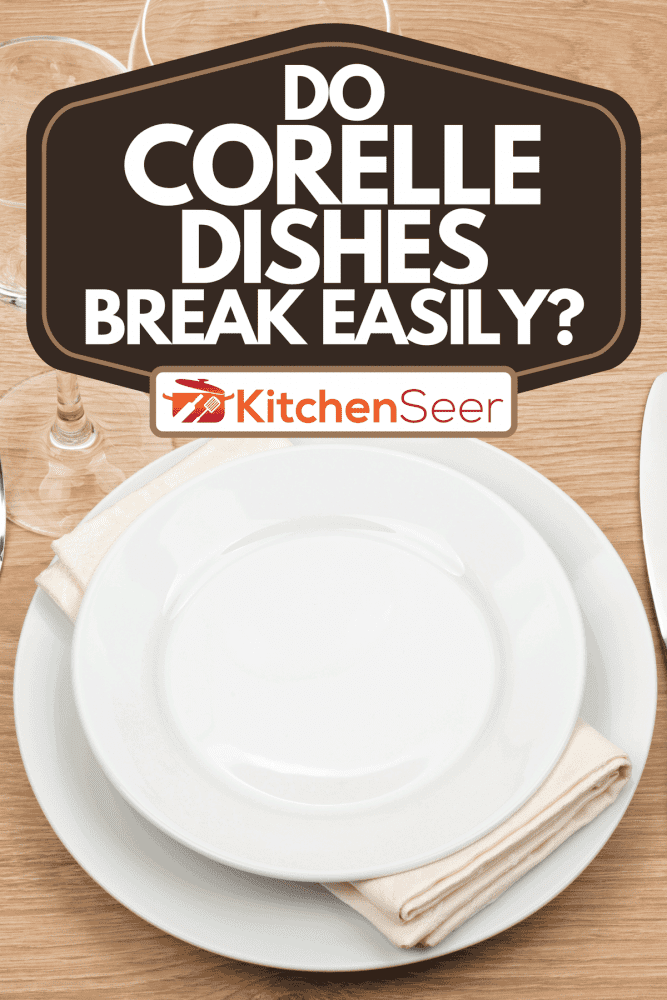 An empty plate, glasses and silverware set on wooden table, Do Corelle Dishes Break Easily?