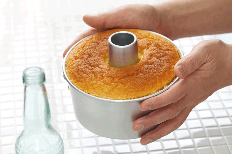 Homemade-orange-chiffon-cake-being-cooled.-What-Types-Of-Pans-For-Baking-Angel-Food-Cake