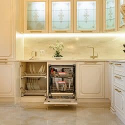 Large luxury beige and gold classic kitchen interior with furniture