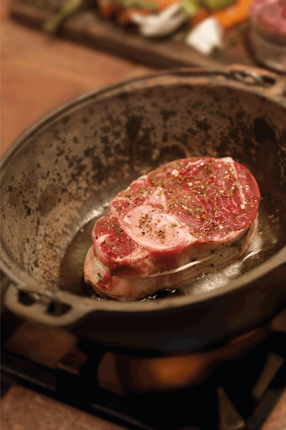Preparing Osso Buco, Raw Veal Shanks Being Seared in a Cast Iron Pot preparation for braising