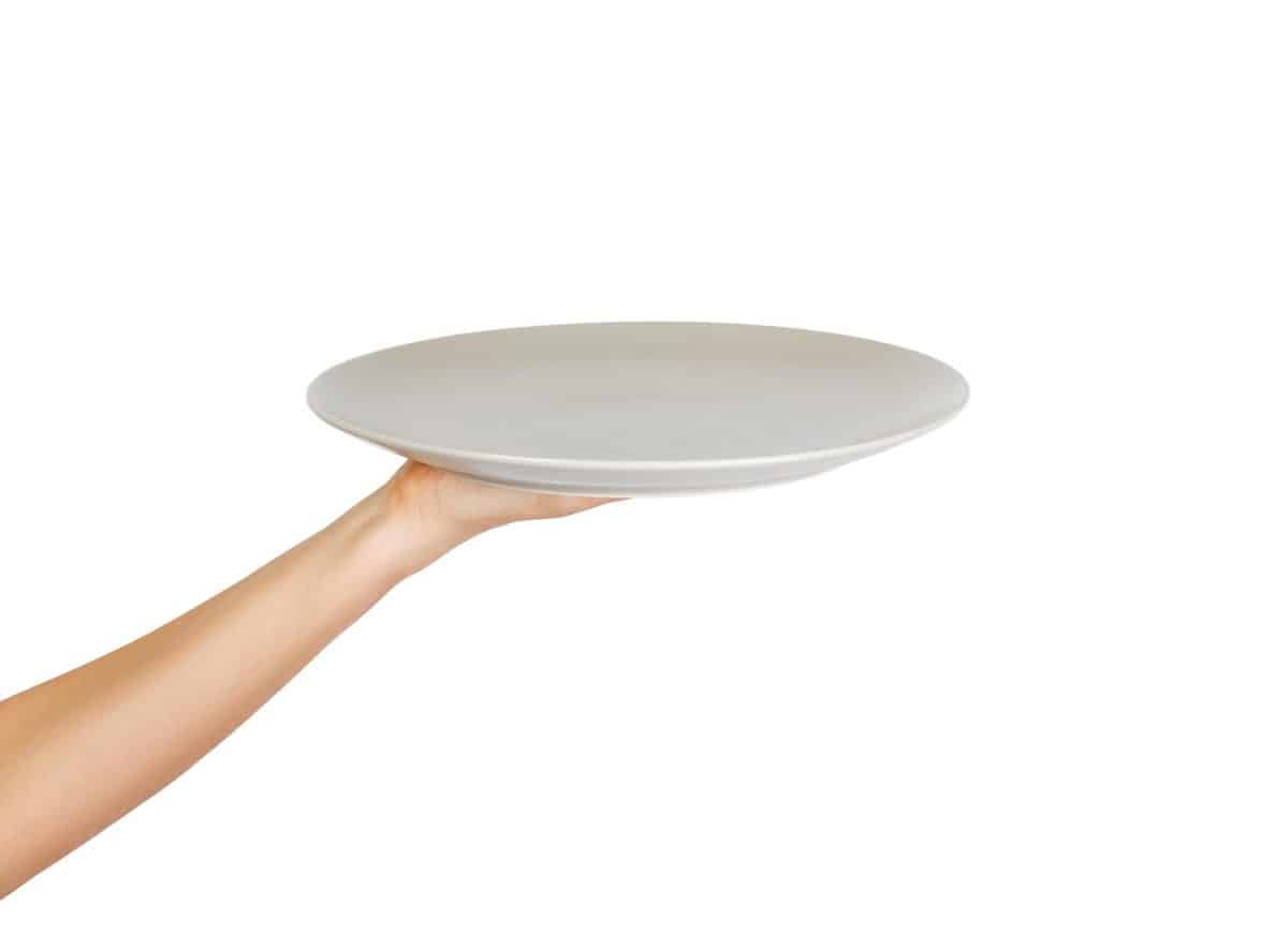 White kitchen plate on hand