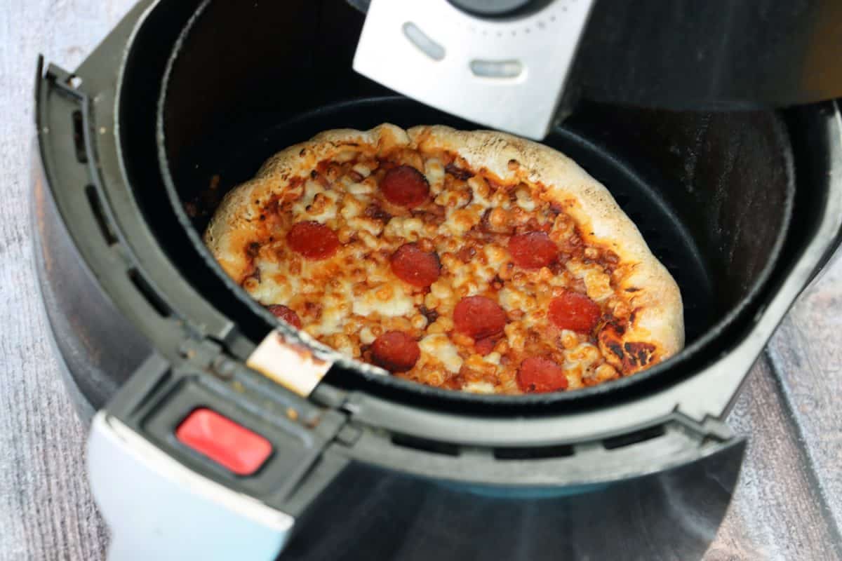 f sliced pepperoni pizza, topped with a rich tomato sauce, melted grated mozzarella and circles of pepperoni sausage served in air fryer pan