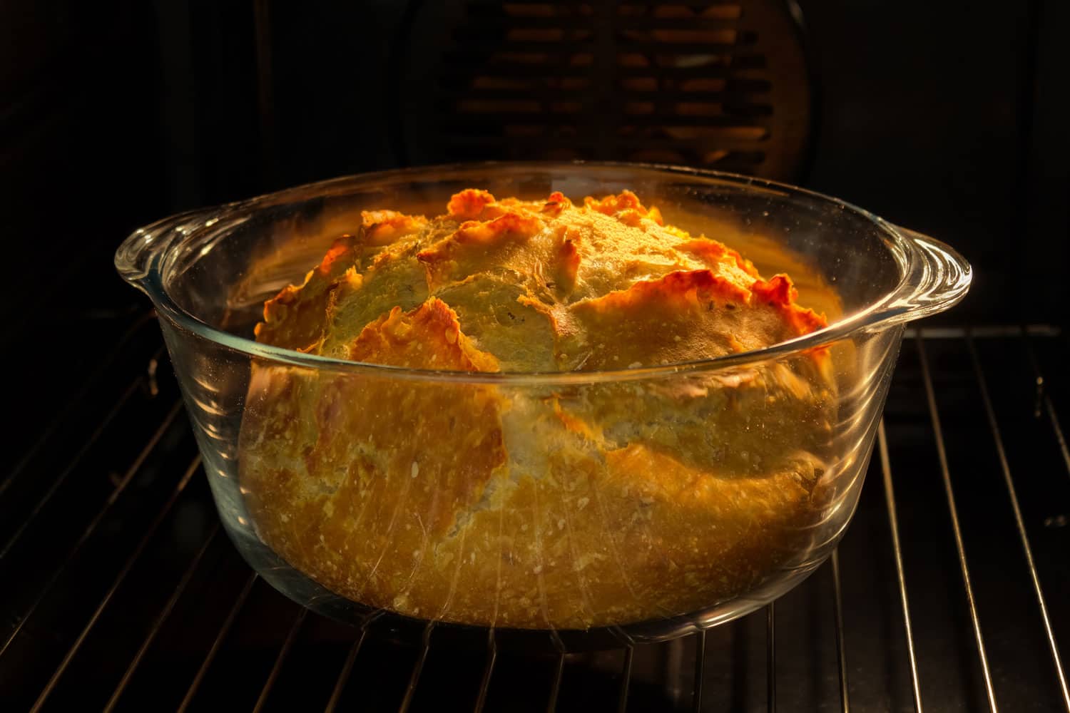 freshly baked loaf in glass loaf pan