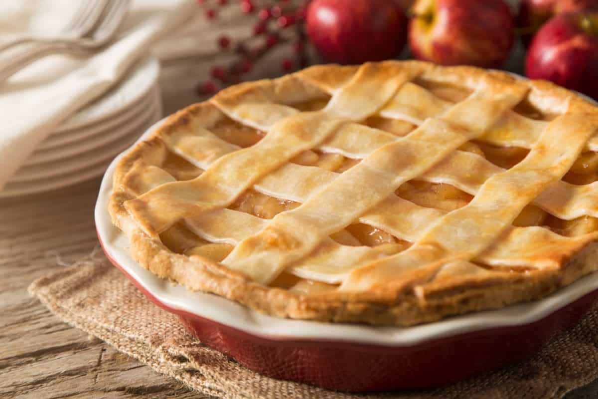 A delicious apple pie with apples on the back