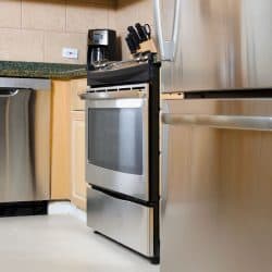 A modern kitchen with stainless steel appliances including dishwasher, How To Reset A Kitchenaid Dishwasher