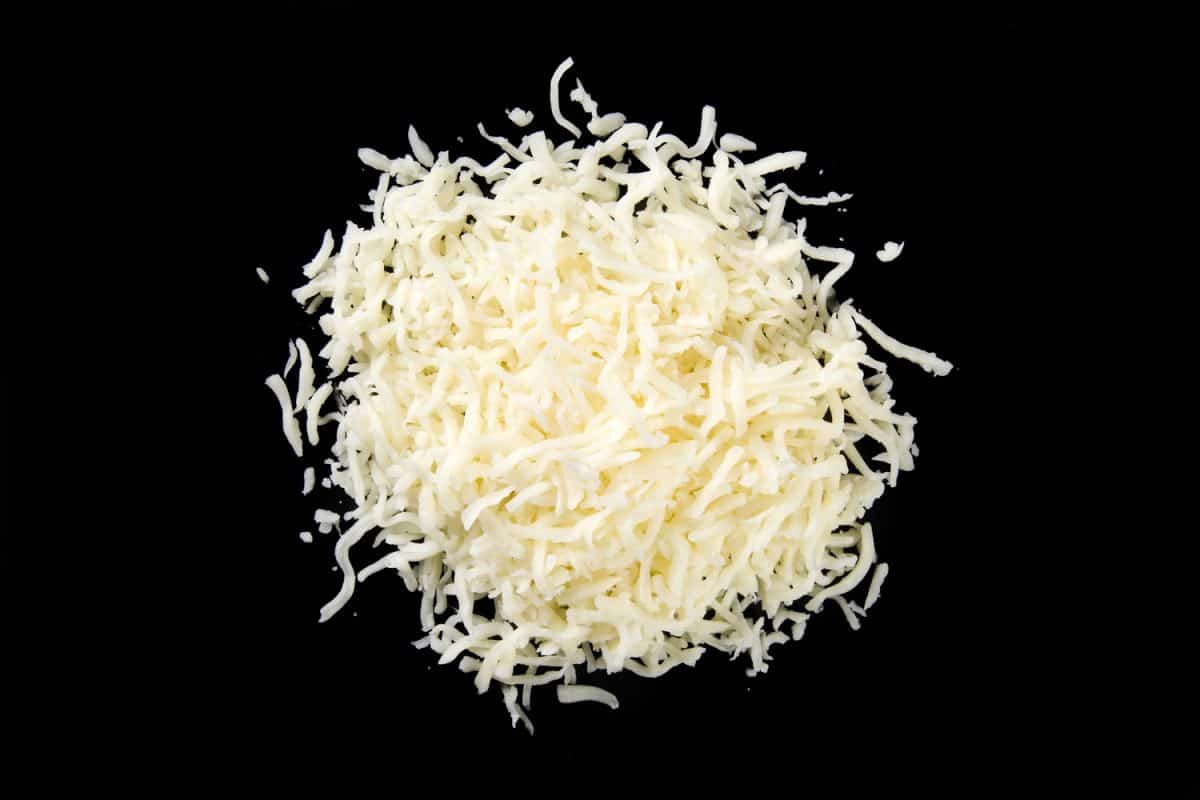 A mount of mozzarella cheese on a black background