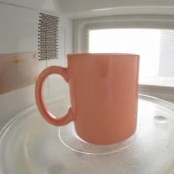 A mug standing on a microwave plate, What Kind Of Mugs Are Oven-Safe?