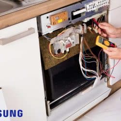 A repairman fixing dishwasher, Samsung Dishwasher Leak Sensor Alarm But No Leak - What To Do