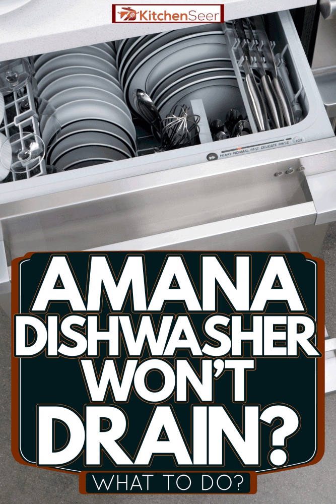 An opened dishwasher with lots of newly washed dishes, Amana Dishwasher Won't Drain—What To Do?