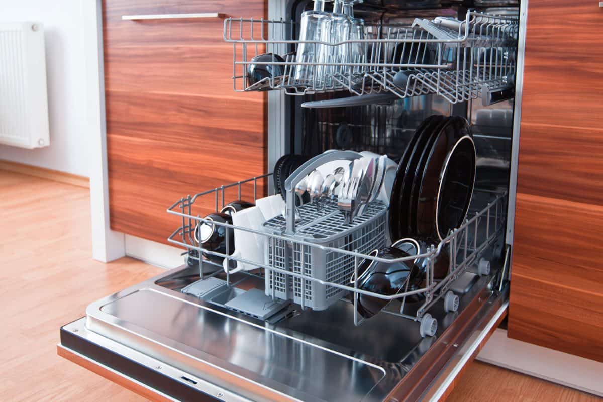 An opened dishwasher left open to let the steam out, How To Protect A Countertop From Dishwasher Steam
