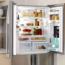 An opened double door fridge containing lots of cooking essentials, At What Temperature Should A Bosch Fridge Freezer Be Set?