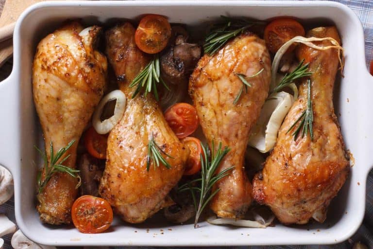 Baked chicken legs with vegetables close-up, How Long Should You Bake Chicken Legs And At What Temperature?