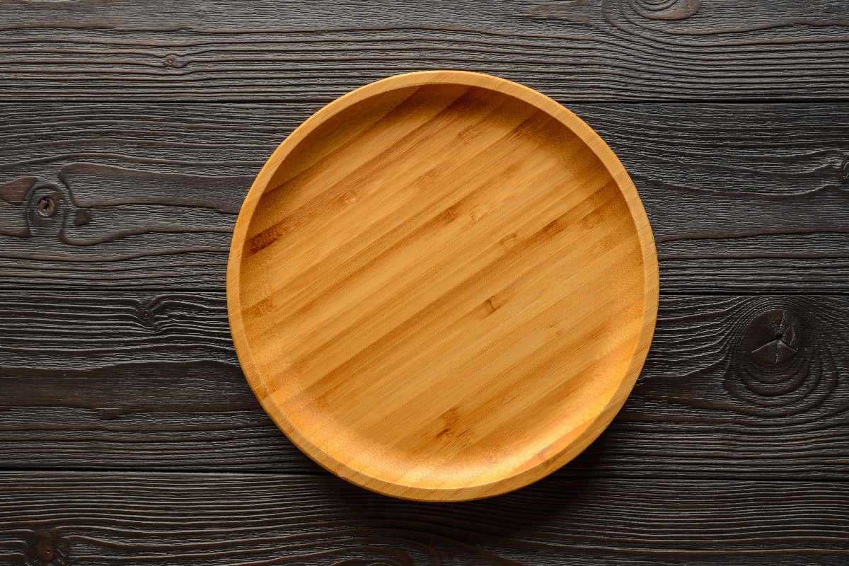 Bamboo plate on wooden background