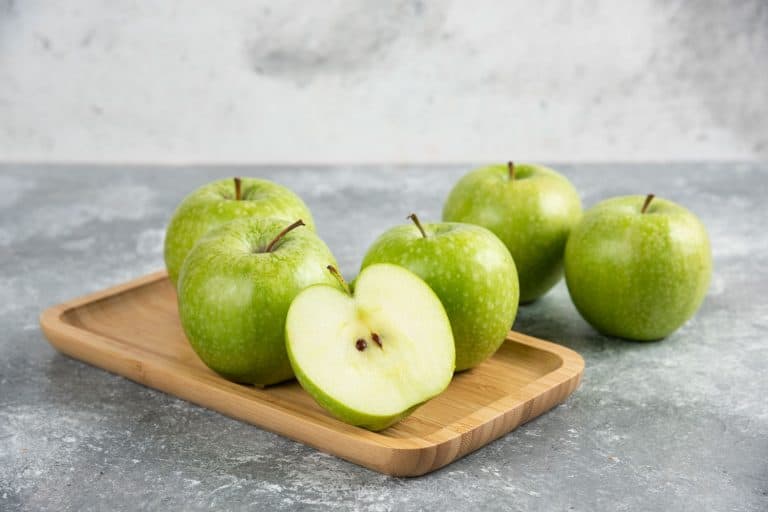 Bunch of whole and sliced green apples on wooden plate., How To Freeze Granny Smith Apples