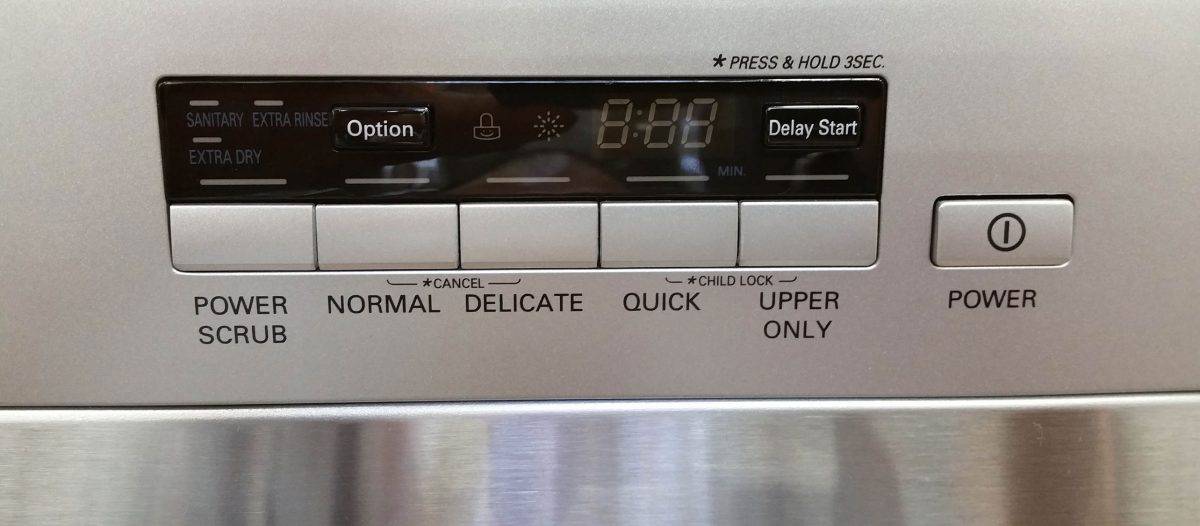 Buttons located in front of a dishwasher