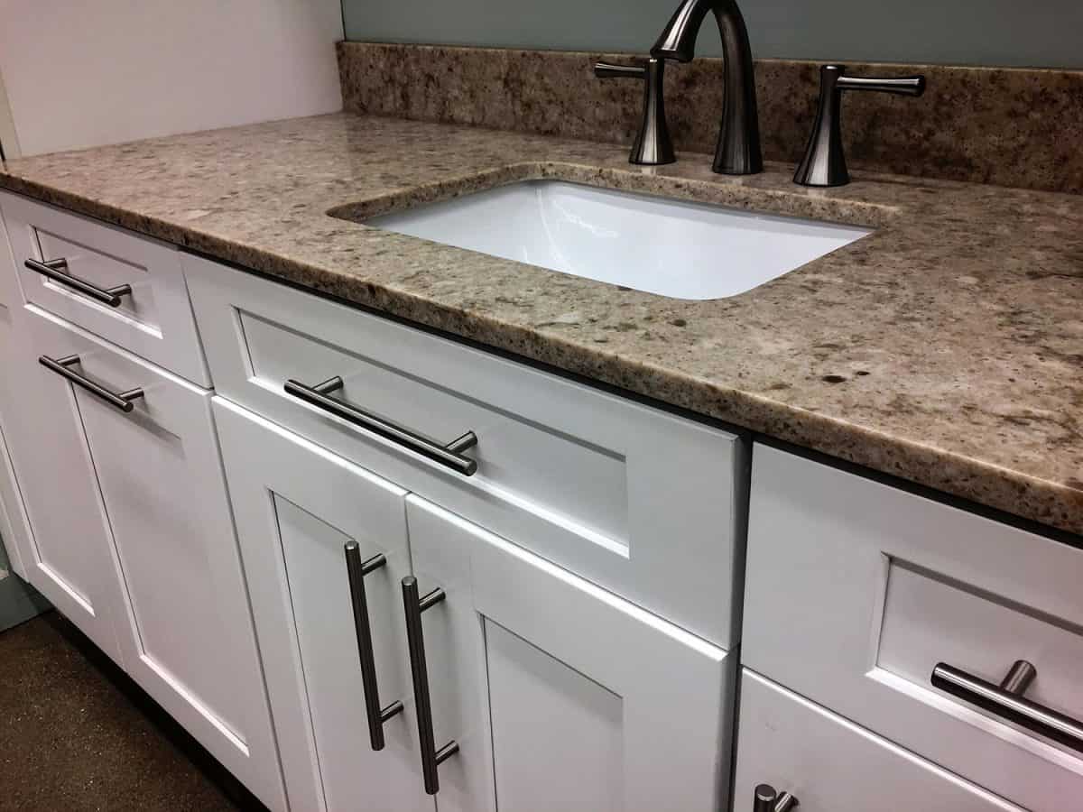 Close up of kitchen sink and cabinets