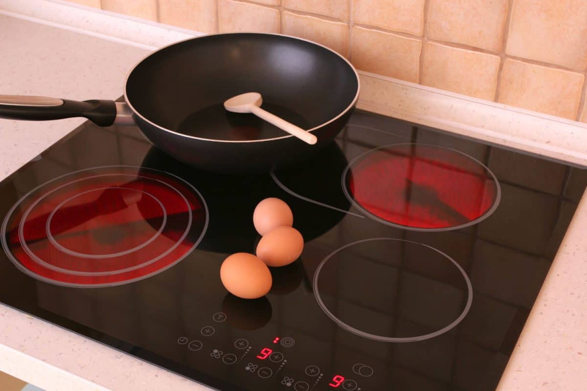 cooking eggs on a glass top stove in a non stick pan