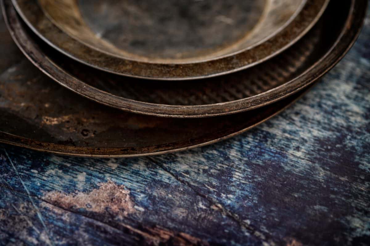 Food photography, baking pans on rustic blue background