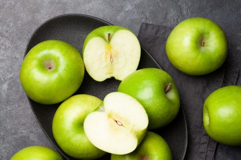 Green apples in a small gray plate with a slice piece, Are Granny Smith Apples Good For Applesauce?