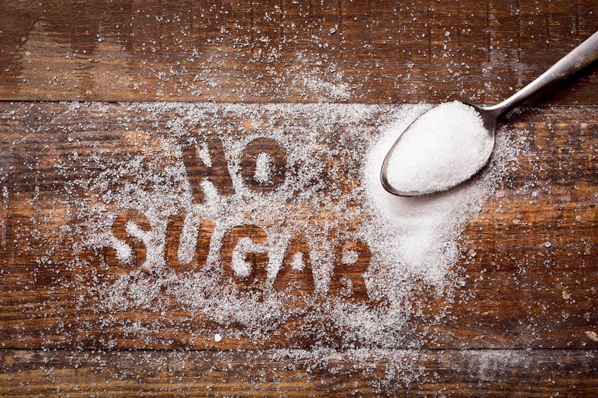 High-angle shot of a wooden table sprinkled with sugar