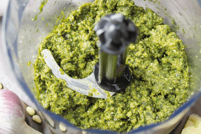 High angle view at genovese pesto sauce in food processor bowl. Cuisinart Food Processor Won't Spin—What To Do