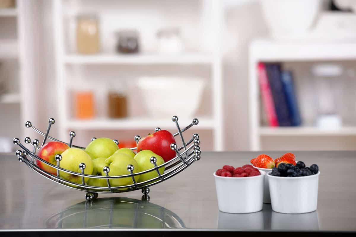 Portrait of fruit on a kitchen worktop.