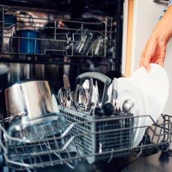 Woman using dishwasher to wash dishes, What Dishwashers Have Stainless Steel Racks Or Tubs? [11 Options To Consider]