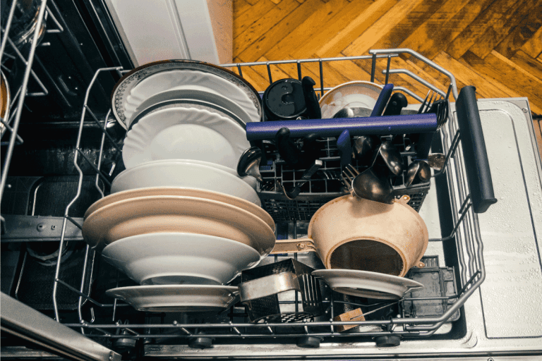 clean dishes and utensils on a open dishwasher. Bosch Dishwasher Cycles Explained—Primary And Secondary Add-Ons