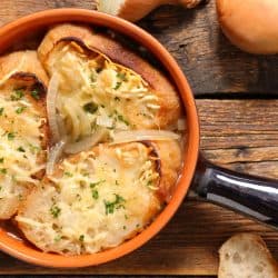 A delicious baked onion soup with French bread on the table, 9 Lipton Onion Soup Mix Substitutes [Including Homemade]