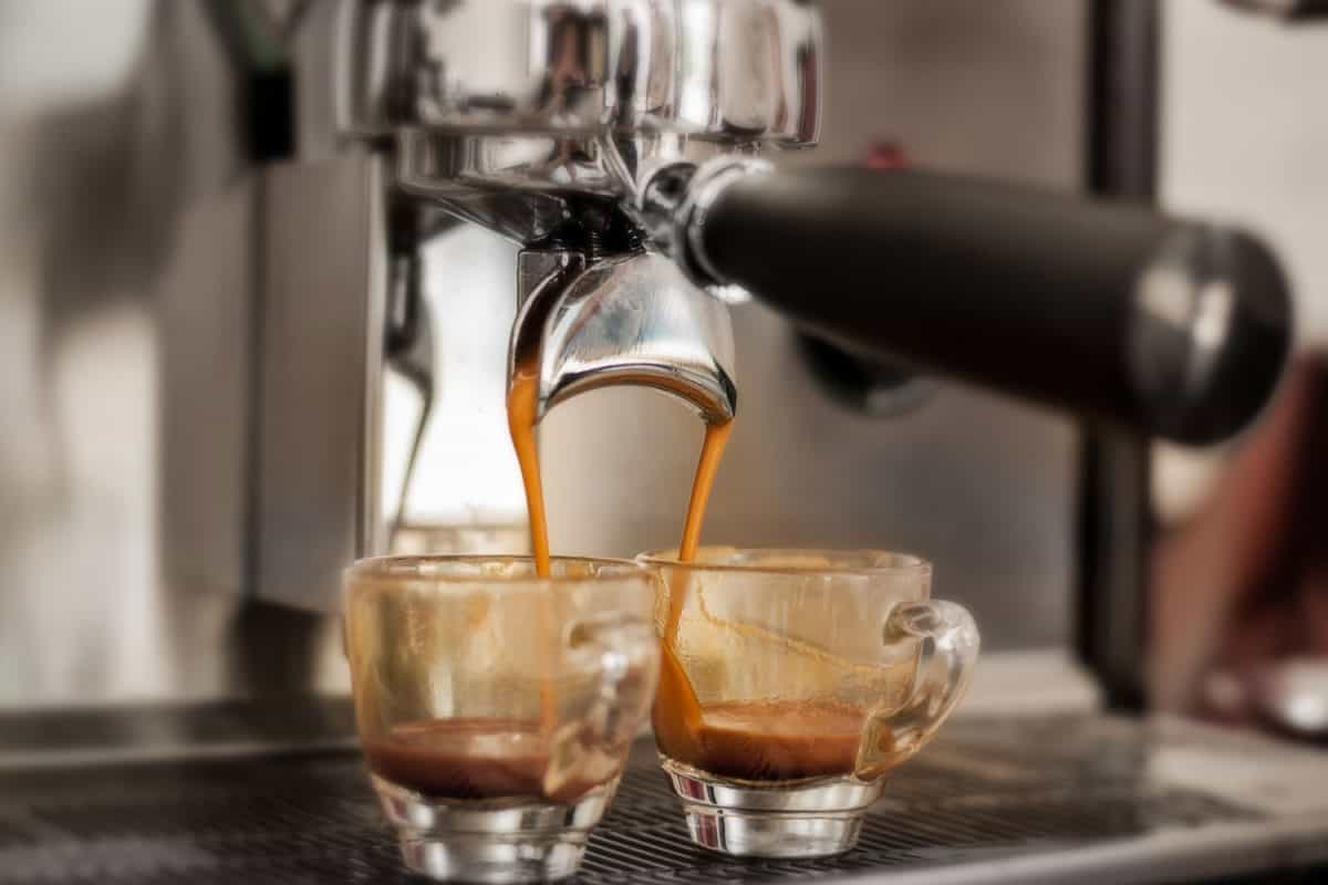 An espresso machine pouring a soothing and relaxing cup of coffee