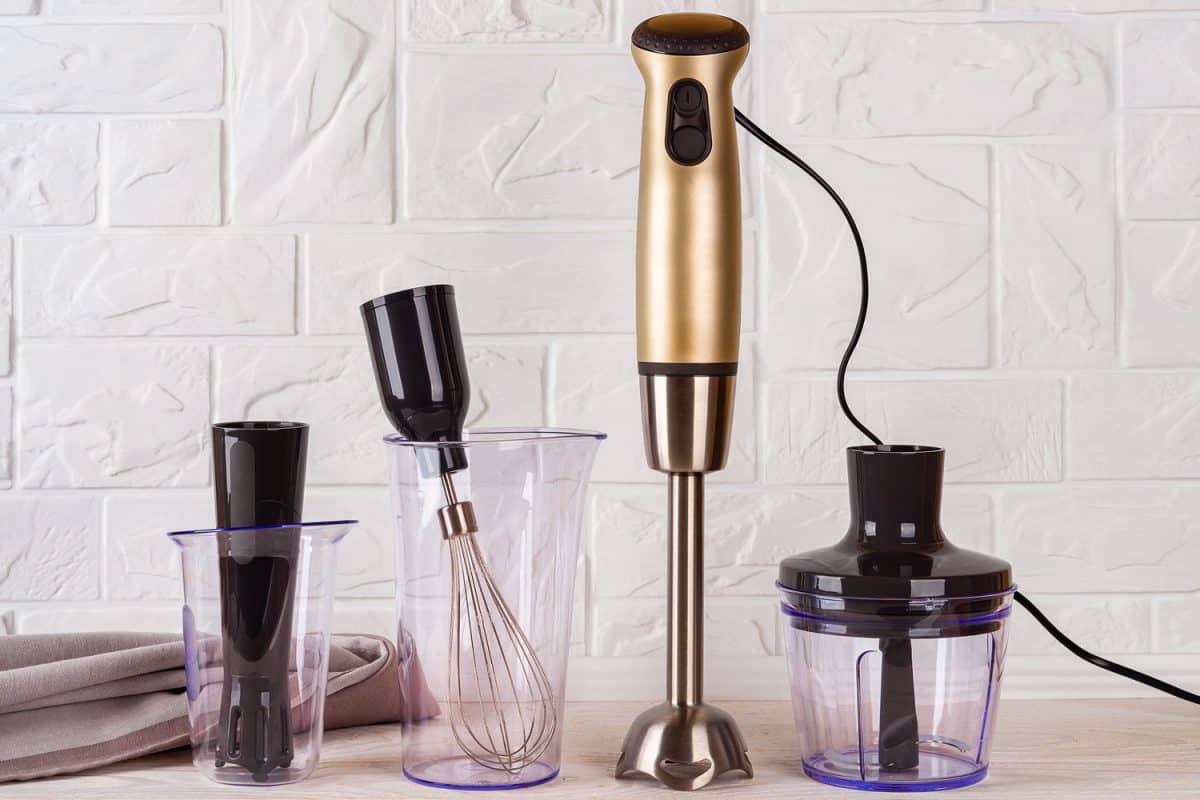 An Immersion blender with different mixing equipment's on the tablea 