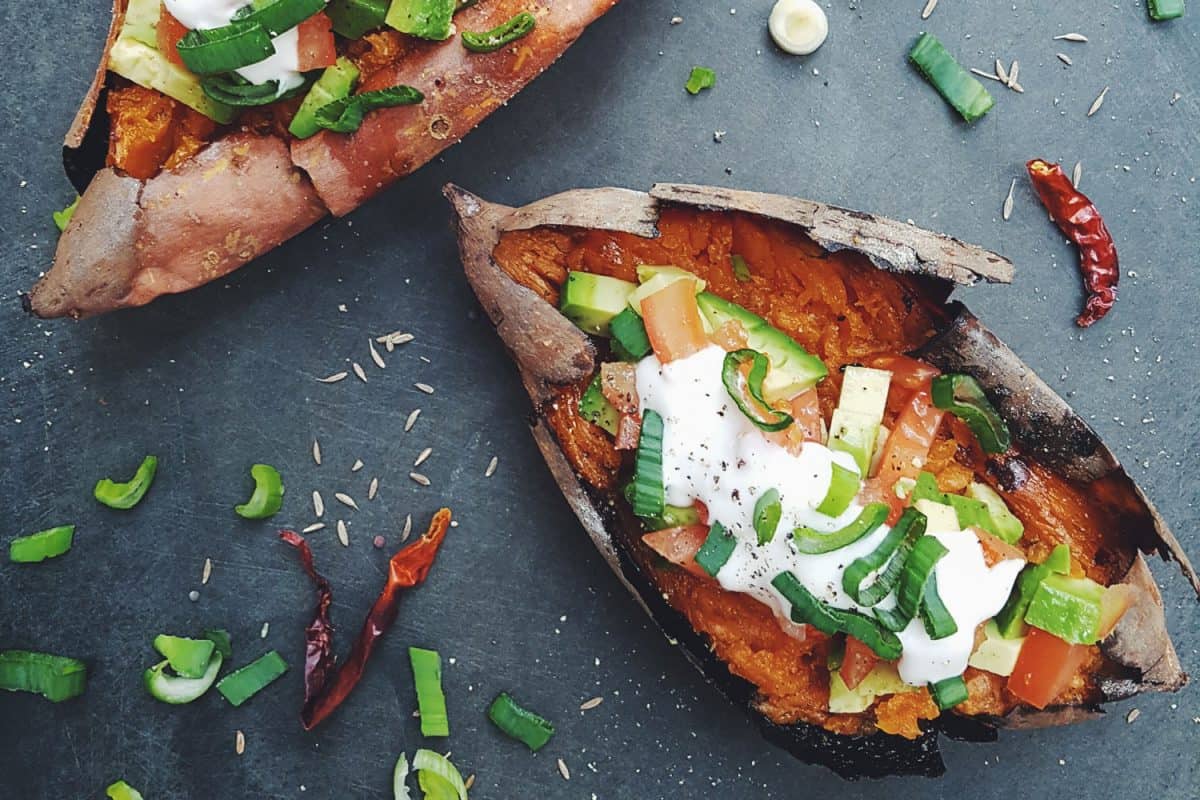 Baked sweet potatoes with avocado and sour cream