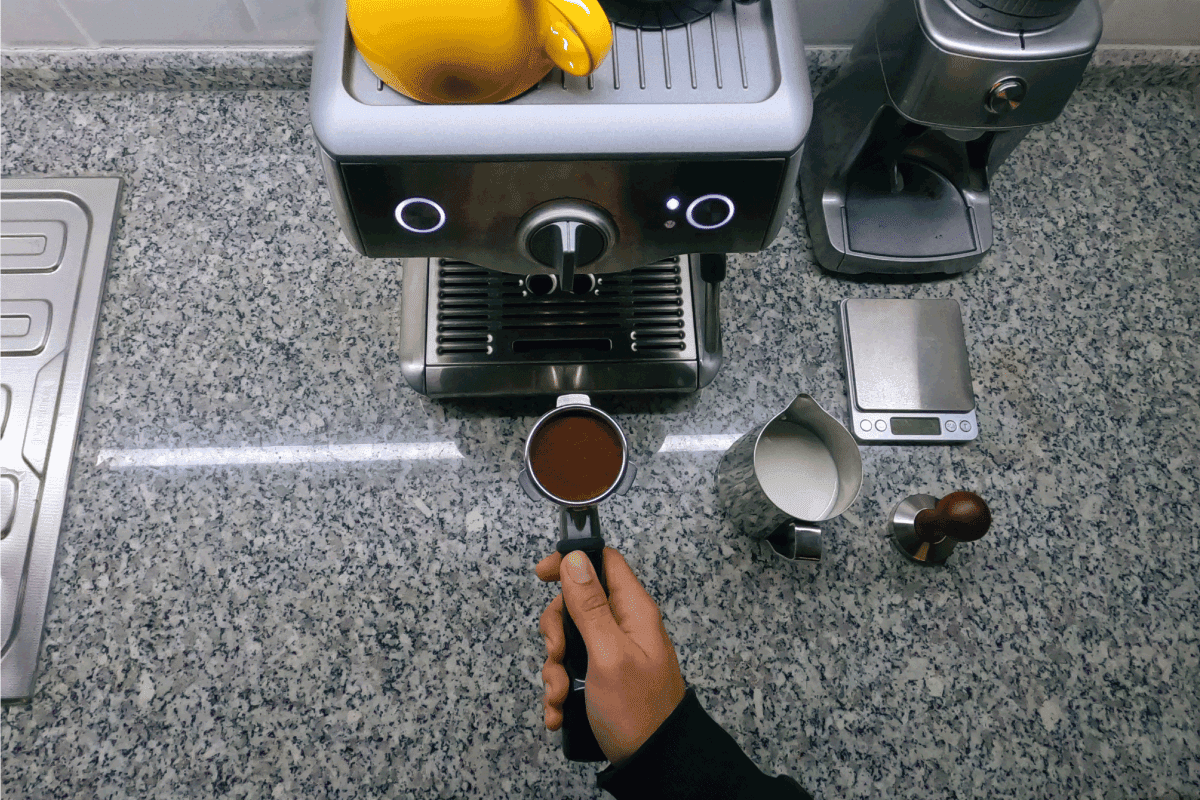 Barista in front of espresso machine. Can You Make Hot Chocolate In An Espresso Machine
