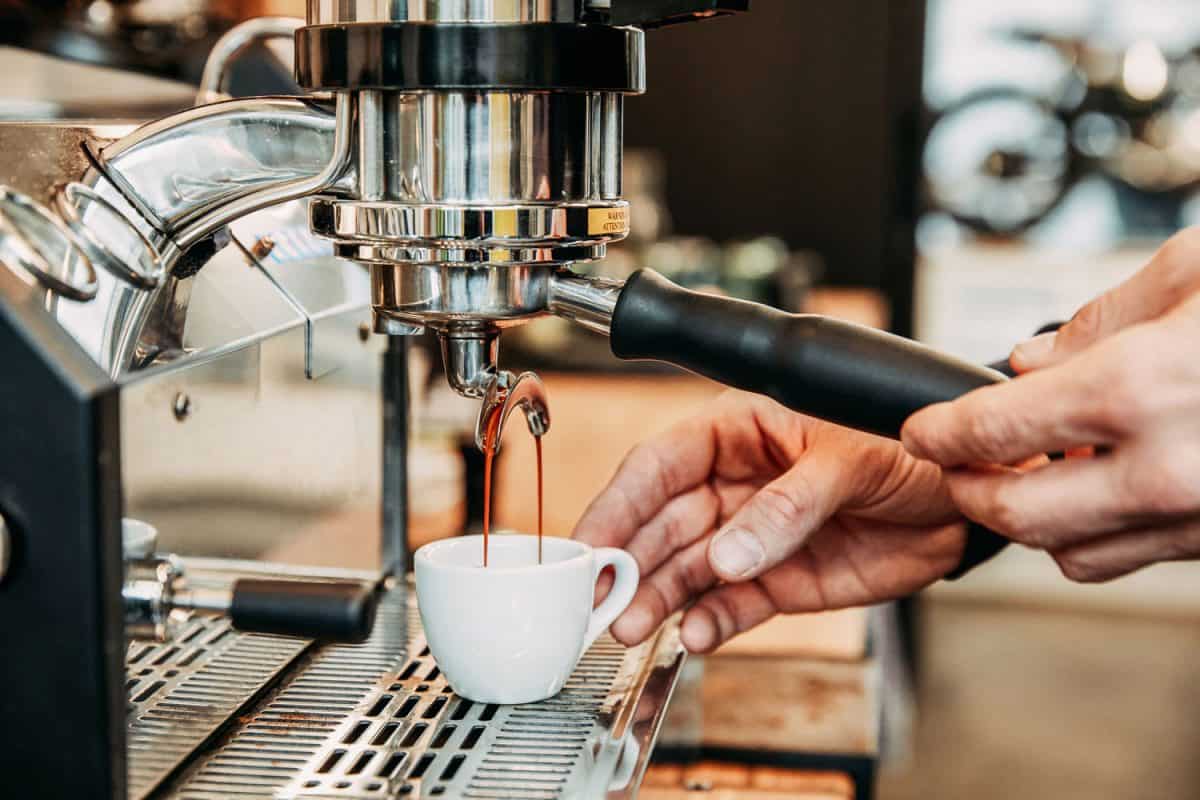 Barista making coffee at an espresso machine