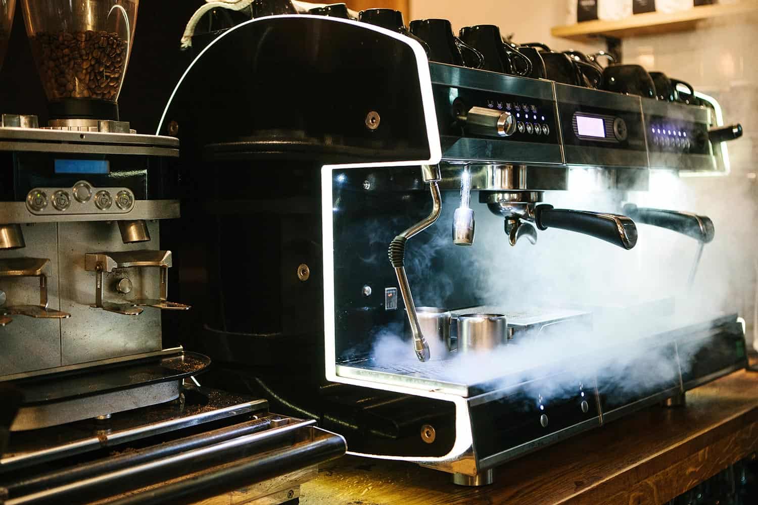 Coffee machine with steam in the process