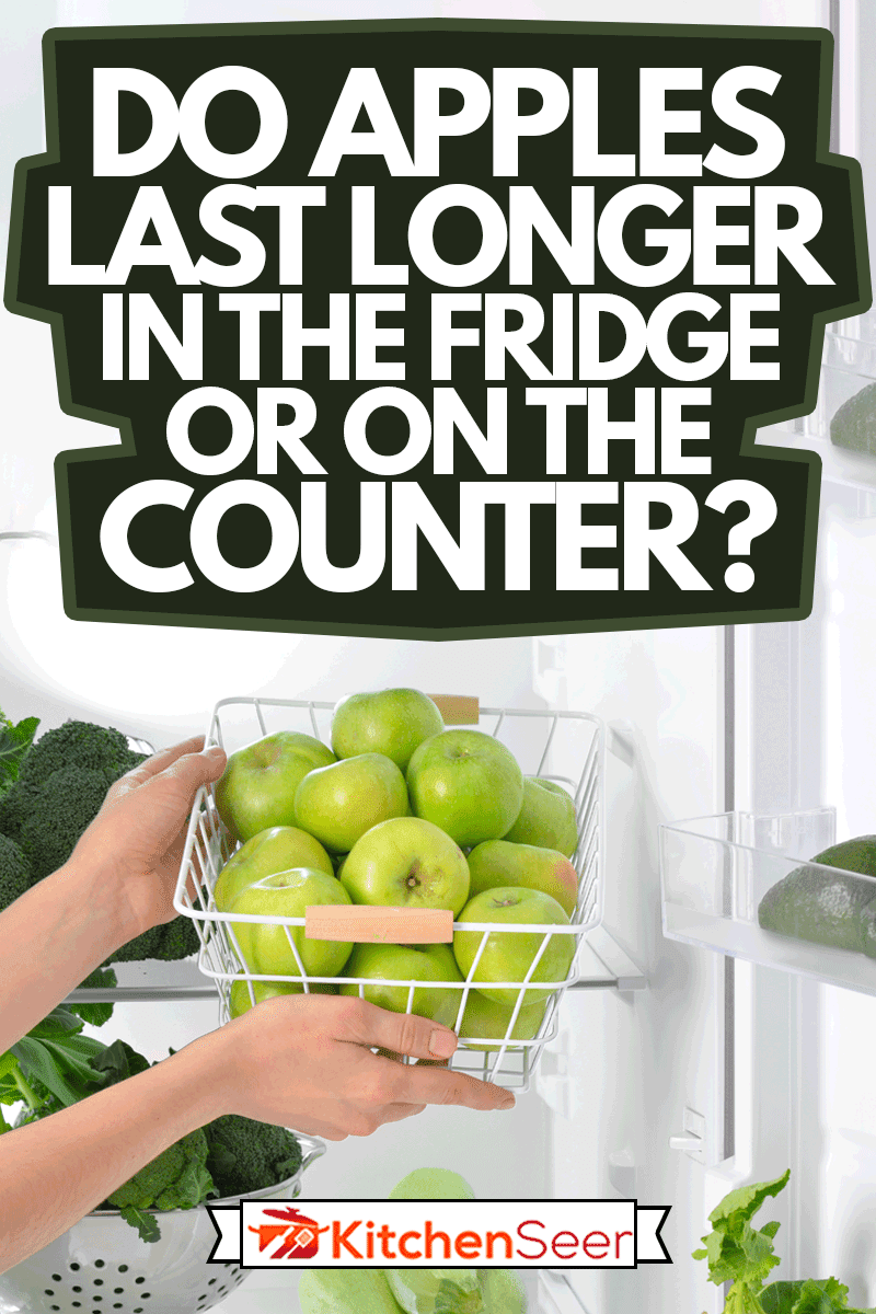 Female hands and basket with fresh apples in fridge, Do Apples Last Longer In The Fridge Or On The Counter?