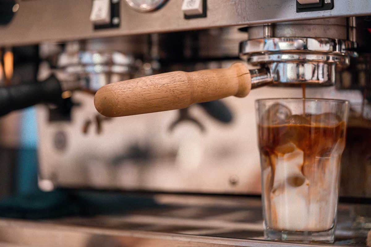 Espresso coffee poured into iced milk