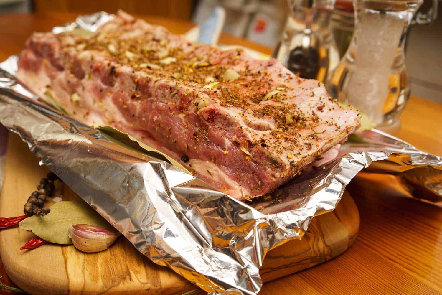Fresh pork ribs marinated and prepared on foil
