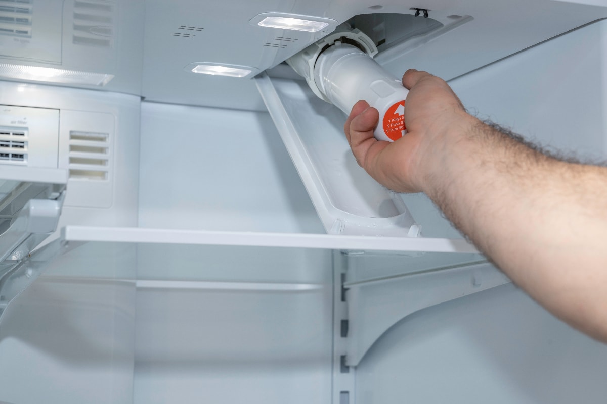Installing a fridge water filter on a modern appliance