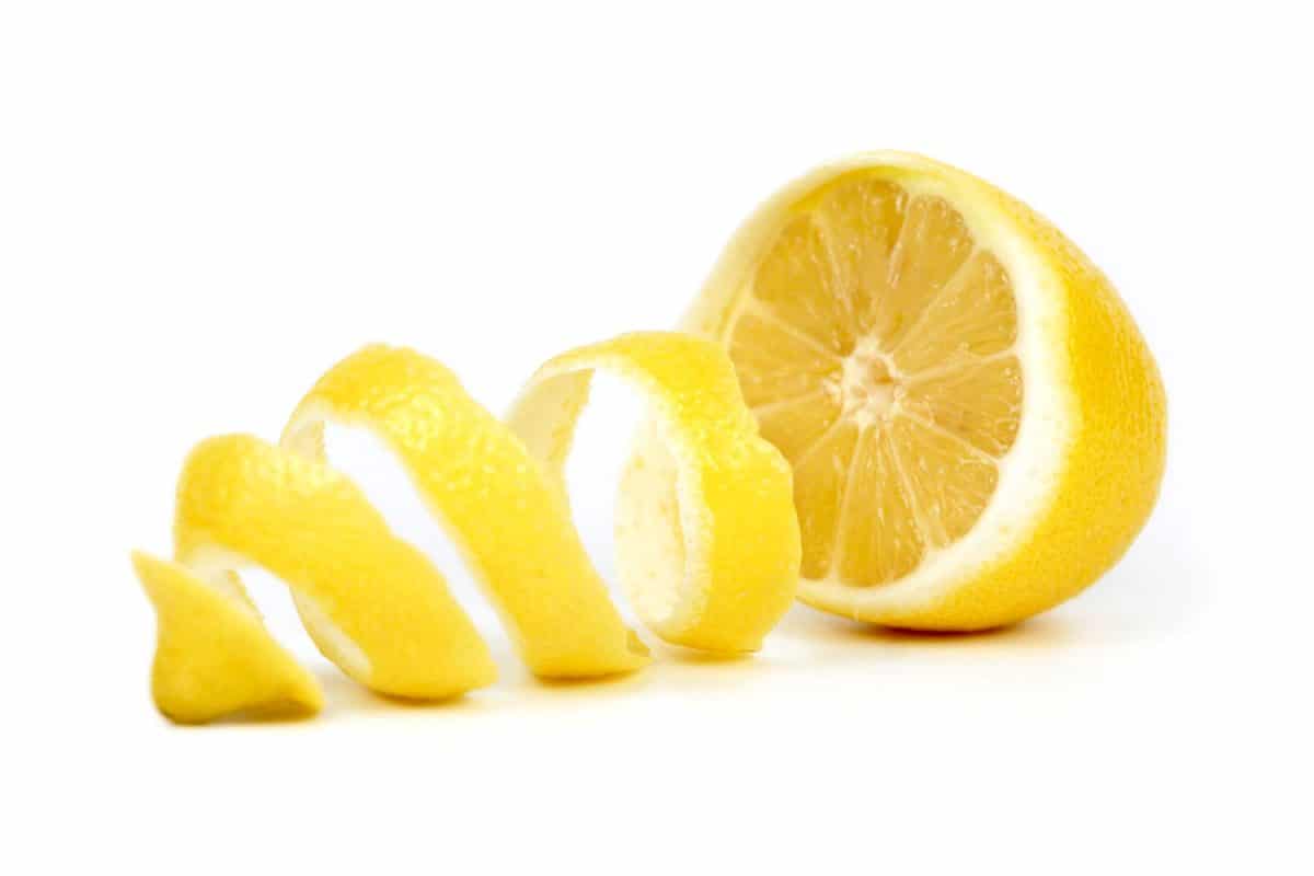 Peeled lemons on a white background
