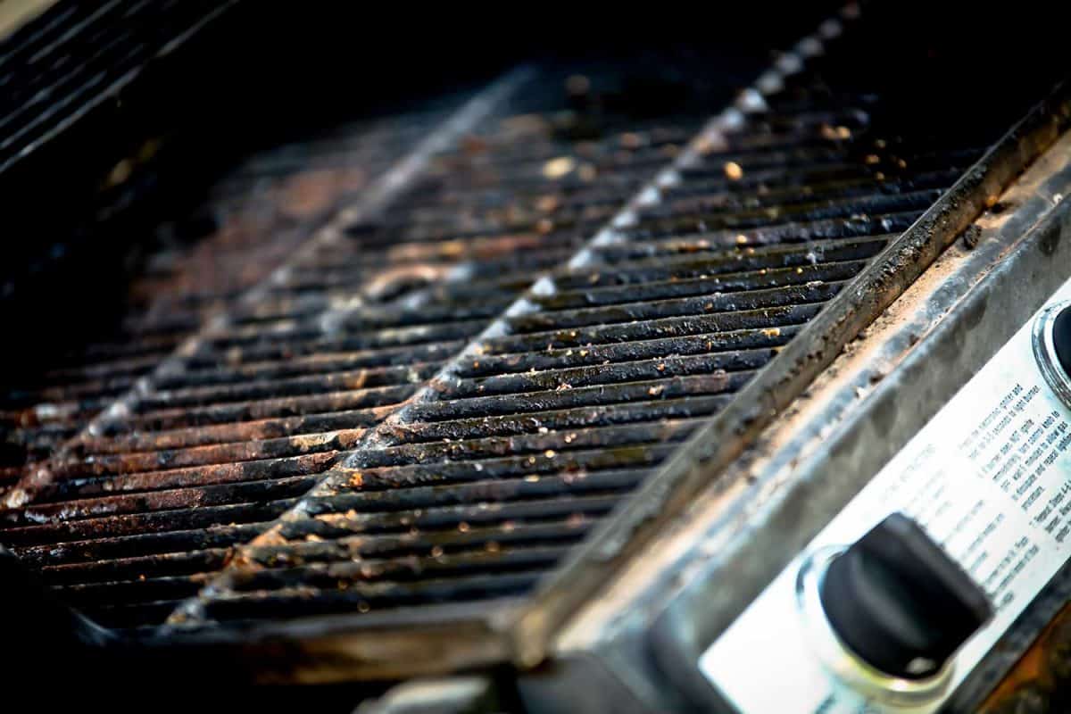 Rusty, dirty, greasy old bbq grill close up