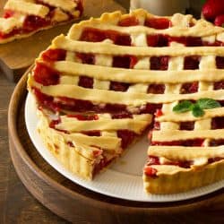 Sweet pie with fresh berry strawberries on a rustic kitchen table, Should You Thaw A Frozen Pie Before Baking?