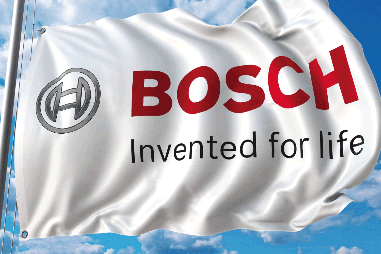 Waving flag with Bosch logo against sky and clouds