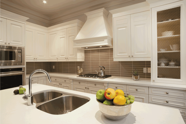 luxury white concept kitchen with sink on the kitchen island. Kitchen Sink In Island - Pros And Cons