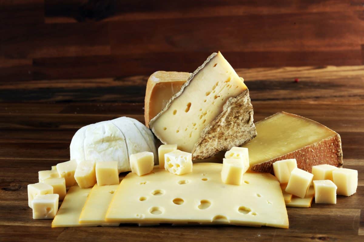 various types of cheese on vintage table