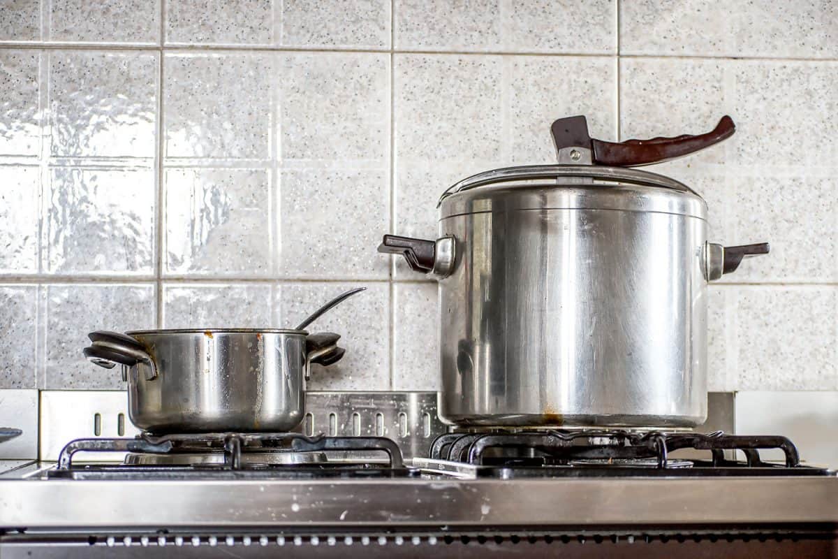 A huge stainless steel induction cooker in the gas burner